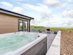 Luxury hot tub lodge with sea views