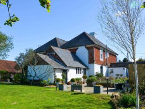 Former farmhouse with hot tub sleeps 10