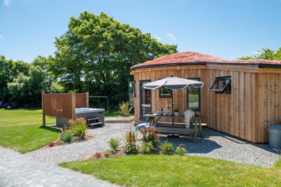 Timber clad roundhouse with hot tub